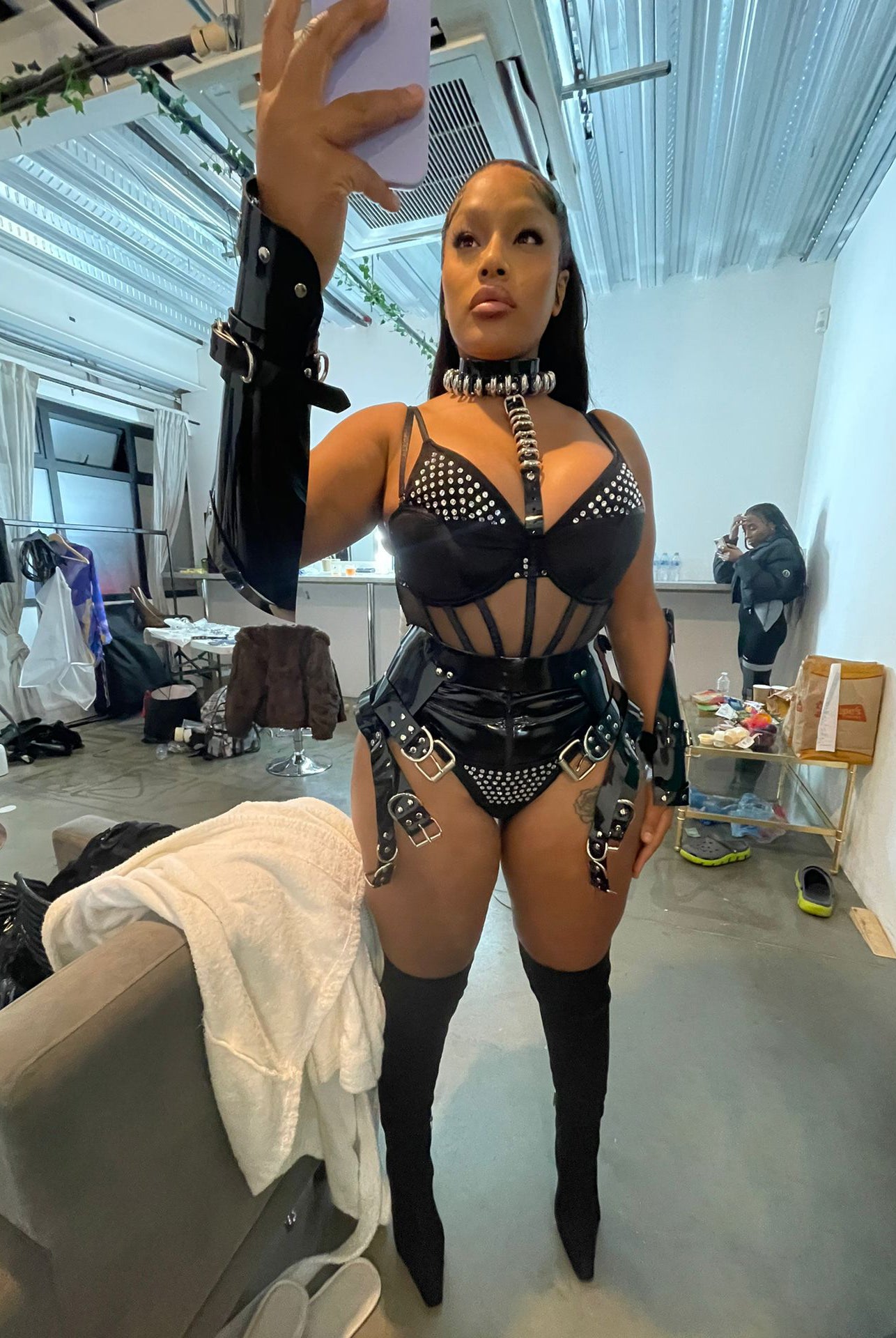 Steff London wearing custom Jivomir Domoustchiev vegan harness multi belt and cuffs