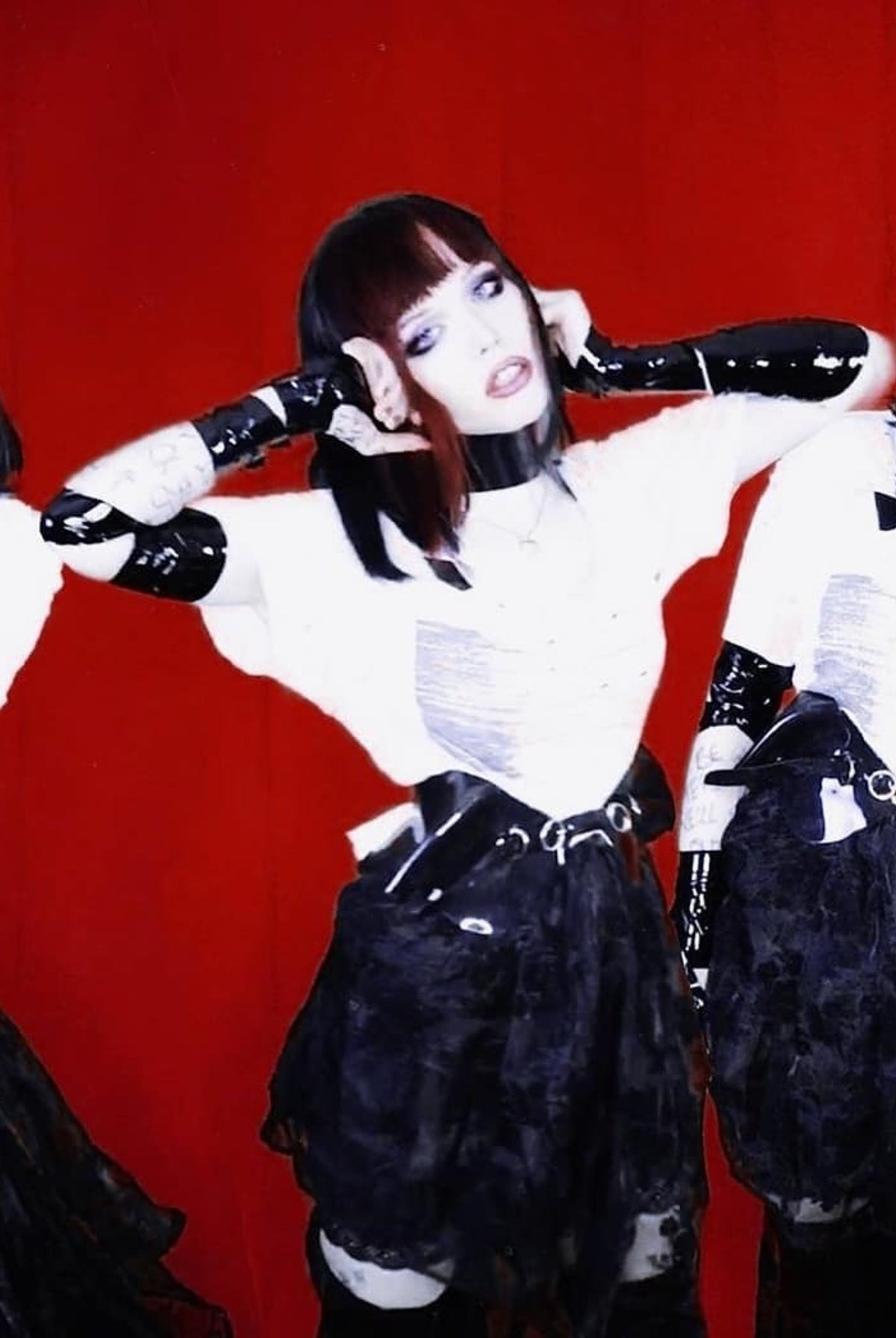 Alice Glass wearing ATÉLIER JIVOMIR black vegan vinyl sculpture belt and matching collar for her new groundbreaking music video for 'Nightmares' MUSIC VIDEO