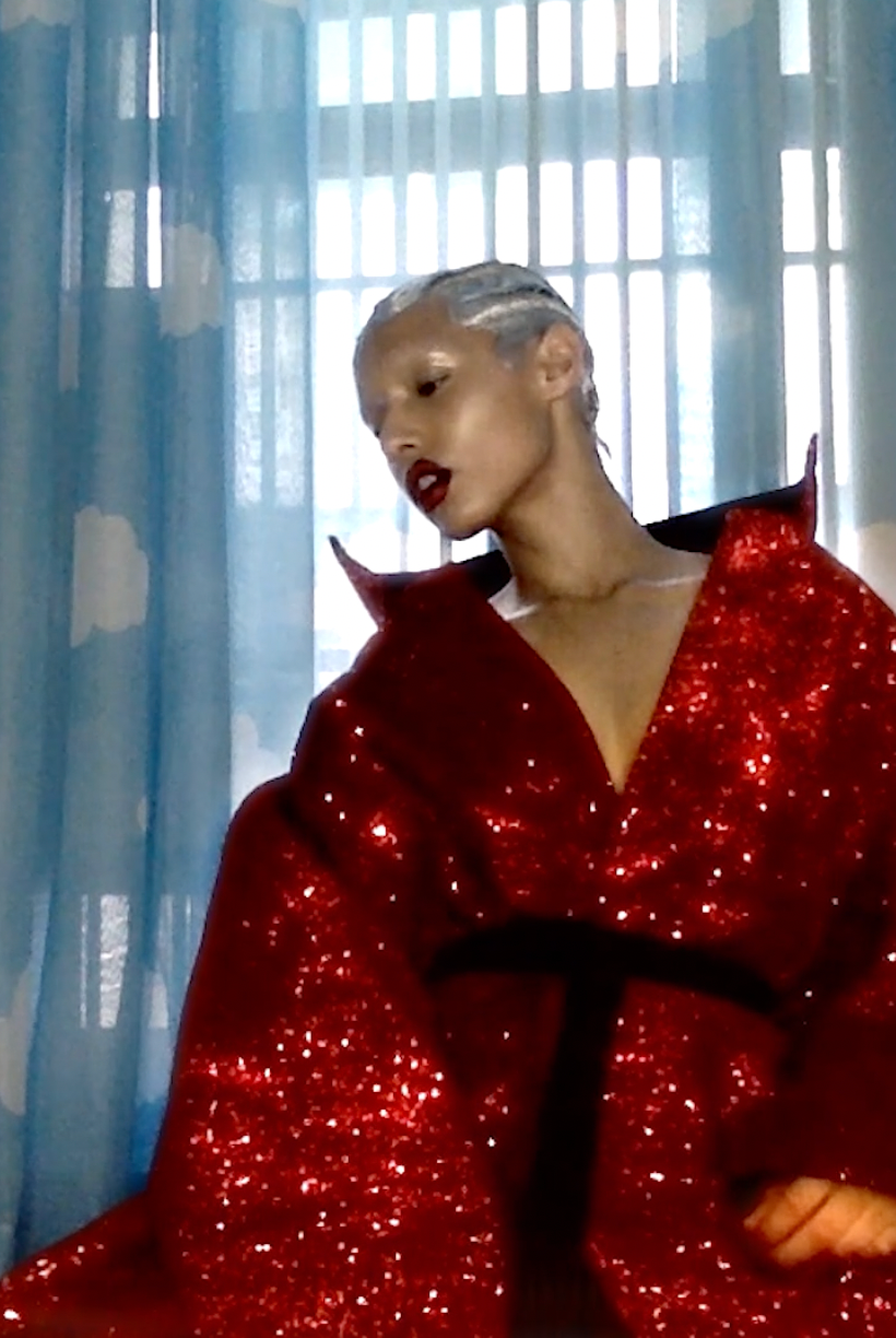 Jazzelle Zanaughtti for Showstudio by Nick Knight wearing ATÉLIER JIVOMIR RED GLITTER COAT