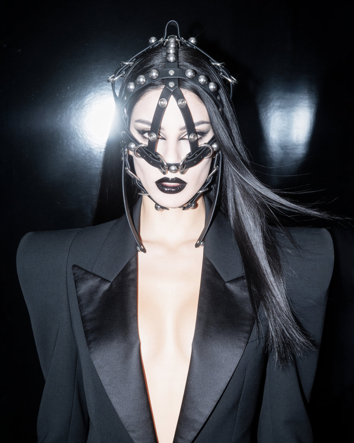 ATÉIER JIVOMIR MASK HEADPIECE FACE HARNESS STUDED LUXURY FASHION KINK ACCESSORY STYLED OVER TAILORING ON MODEL