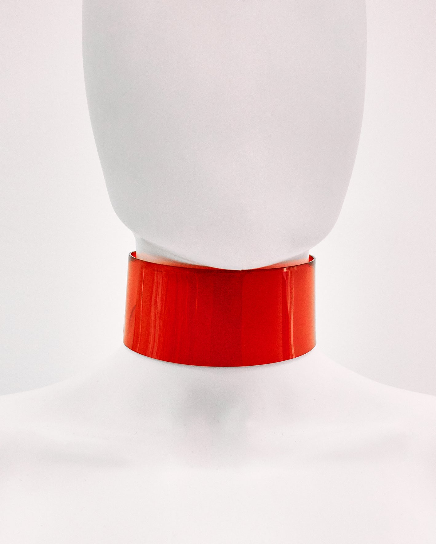 Jivomir Domoustchiev iconic vinyl chocker as seen in the Year and Years Sanctify video. available in a variety of colours. Simple yet striking adjustable for comfort. Finished with silver look studding & buckle. Complements any outfit.