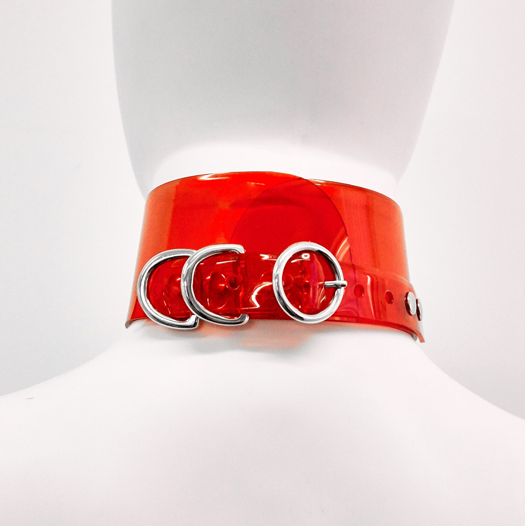 Jivomir Domoustchiev iconic vinyl chocker as seen in the Year and Years Sanctify video. available in a variety of colours. Simple yet striking adjustable for comfort. Finished with silver look studding & buckle. Complements any outfit.