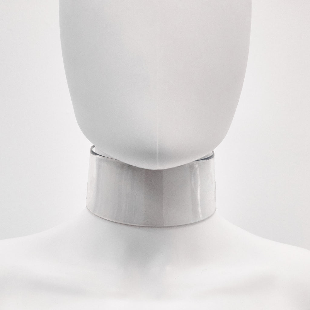 Jivomir Domoustchiev iconic vinyl chocker as seen in the Year and Years Sanctify video. available in a variety of colours. Simple yet striking adjustable for comfort. Finished with silver look studding & buckle. Complements any outfit.