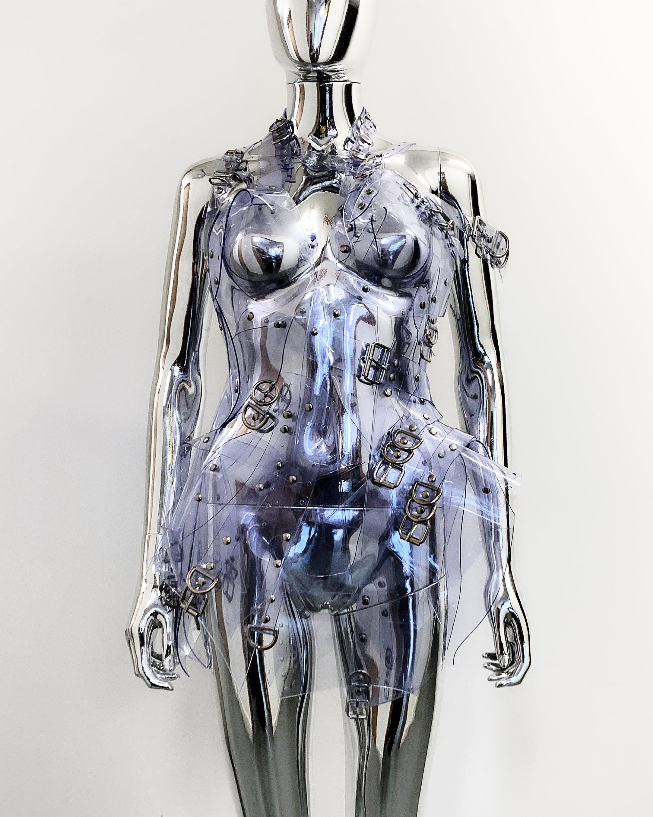 'Onna Bugeisha' collection Jivomir Domoustchiev Asymmetric Dreams Dress dress lovingly made to order in our east London atelier in vegan vinyl and available in a variety of stunning colours and studding details. An artist expression of excessive buckling and pure asymmetrical balance