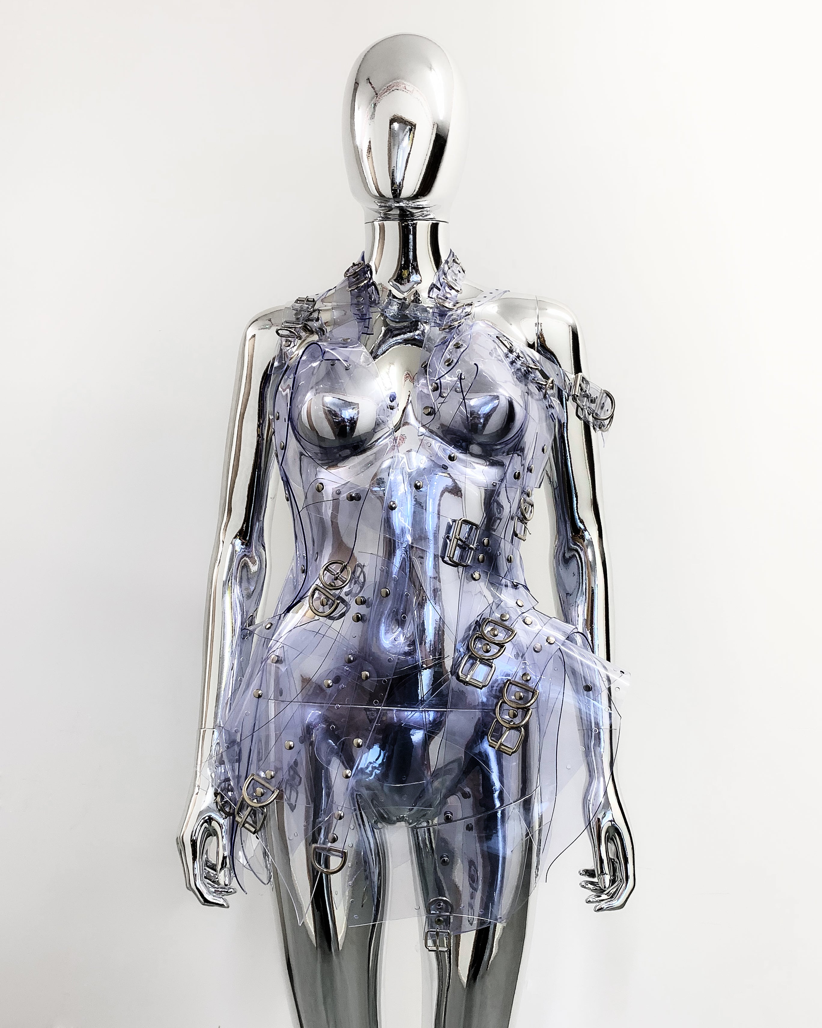 'Onna Bugeisha' collection Jivomir Domoustchiev Asymmetric Dreams Dress dress lovingly made to order in our east London atelier in vegan vinyl and available in a variety of stunning colours and studding details. An artist expression of excessive buckling and pure asymmetrical balance