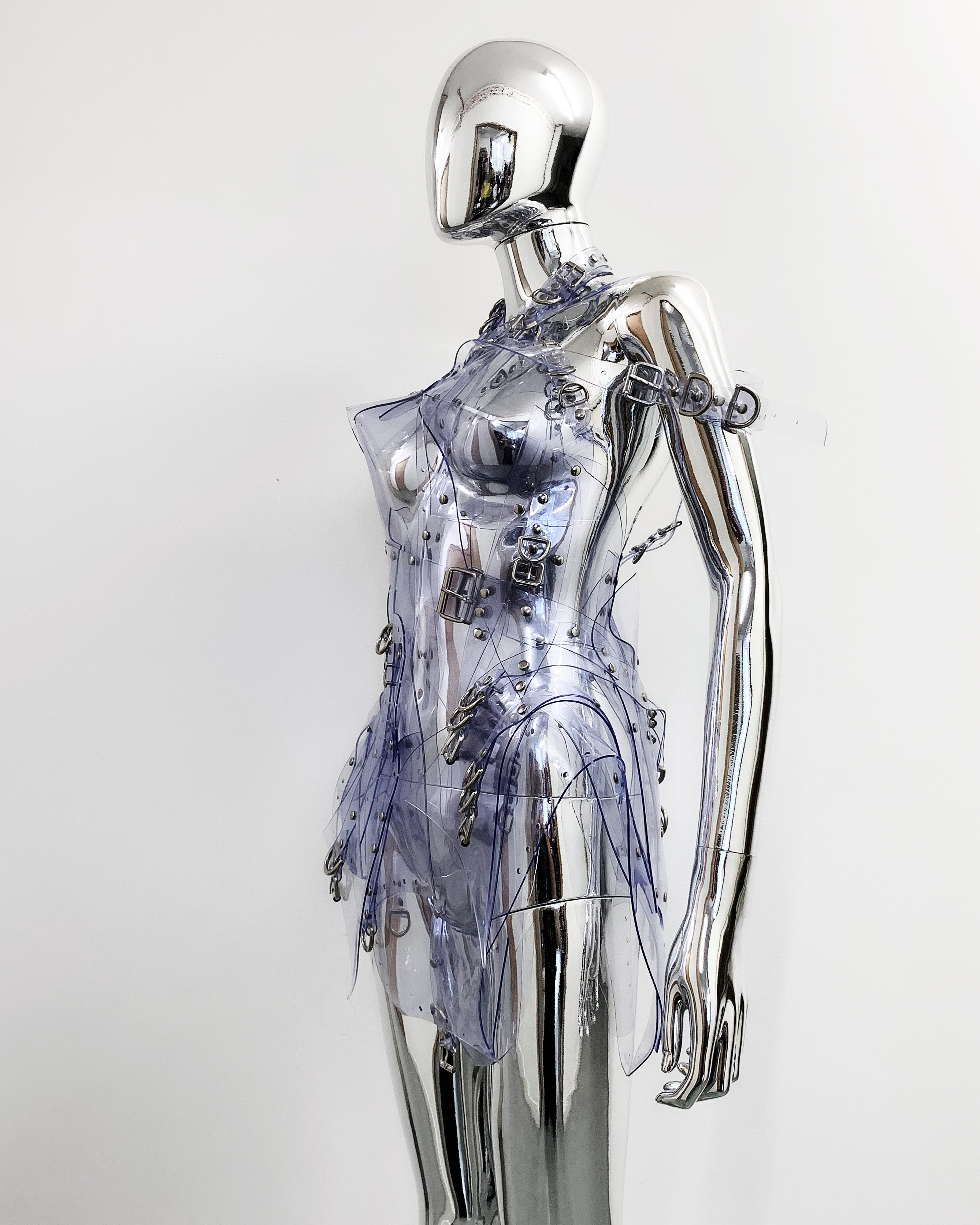 'Onna Bugeisha' collection Jivomir Domoustchiev Asymmetric Dreams Dress dress lovingly made to order in our east London atelier in vegan vinyl and available in a variety of stunning colours and studding details. An artist expression of excessive buckling and pure asymmetrical balance