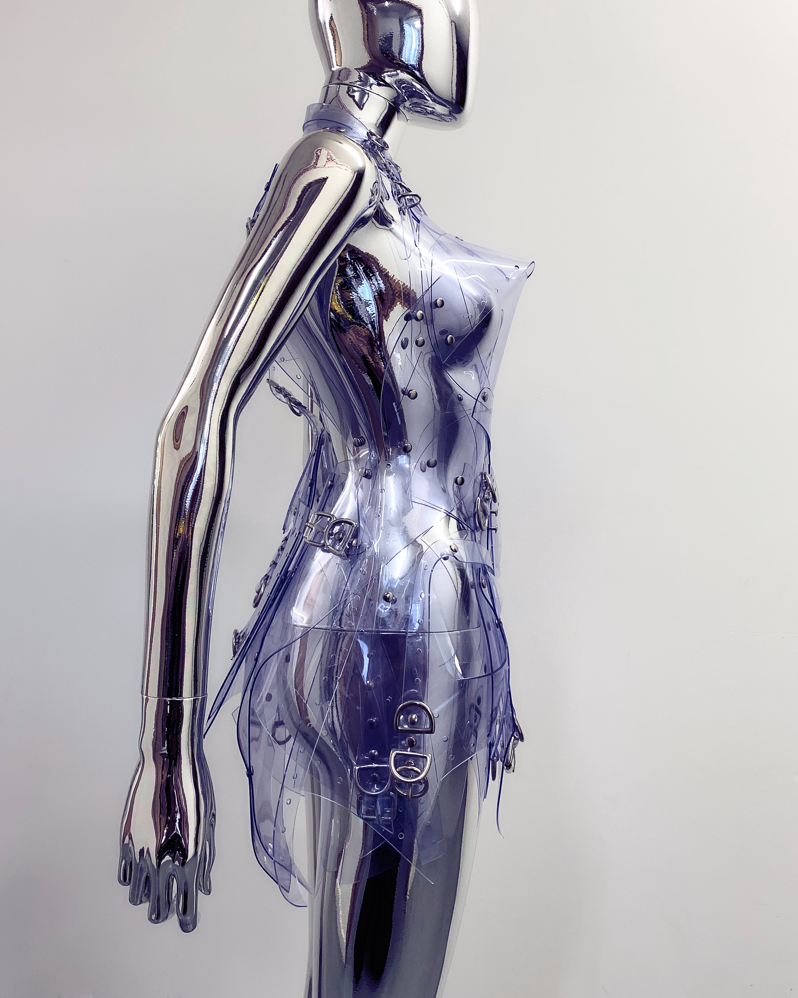 'Onna Bugeisha' collection Jivomir Domoustchiev Asymmetric Dreams Dress dress lovingly made to order in our east London atelier in vegan vinyl and available in a variety of stunning colours and studding details. An artist expression of excessive buckling and pure asymmetrical balance