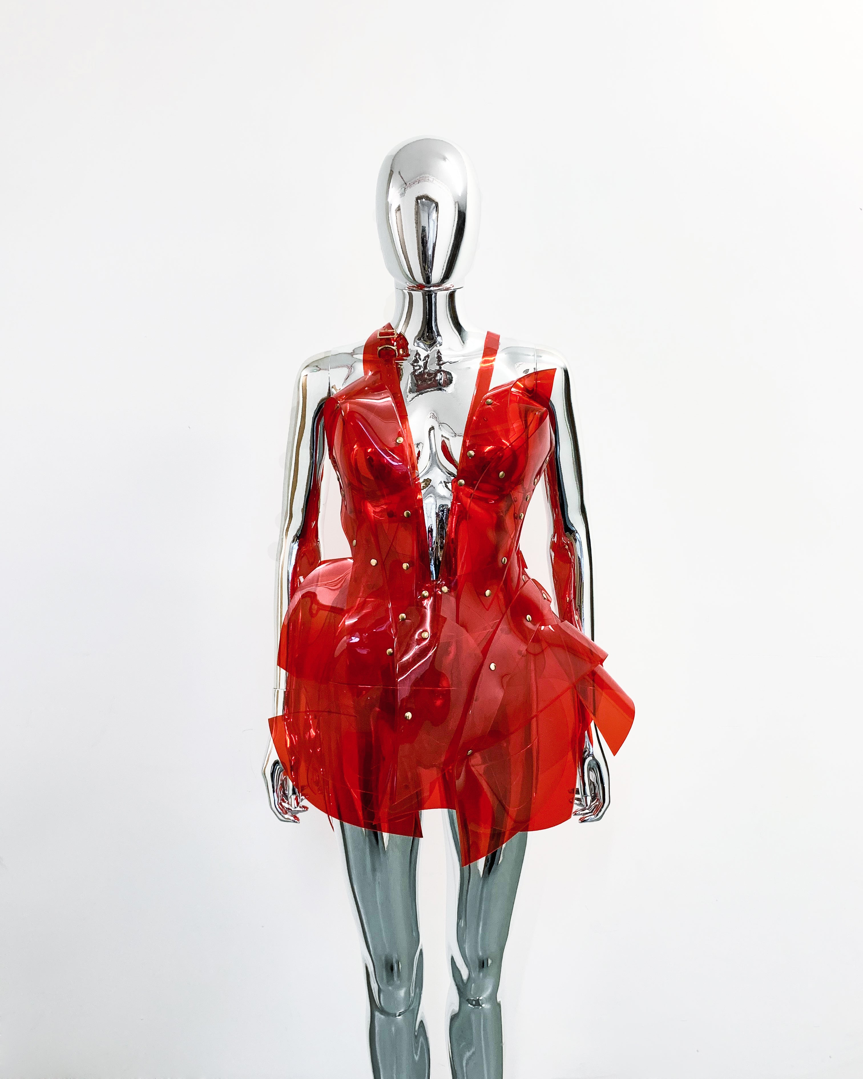 'Onna Bugeisha' collection Jivomir Domoustchiev Asymmetric V Dress lovingly made to order in our east London atelier in vegan vinyl and available in a variety of stunning colours and studding details. An artist expression pure asymmetrical balance contact@jivomirdomoustchiev.com As with all Jivomir Domoustchiev pieces are hand crafted to order please allow up to 4 weeks for shipping.  Shown in clear Valentines Red.