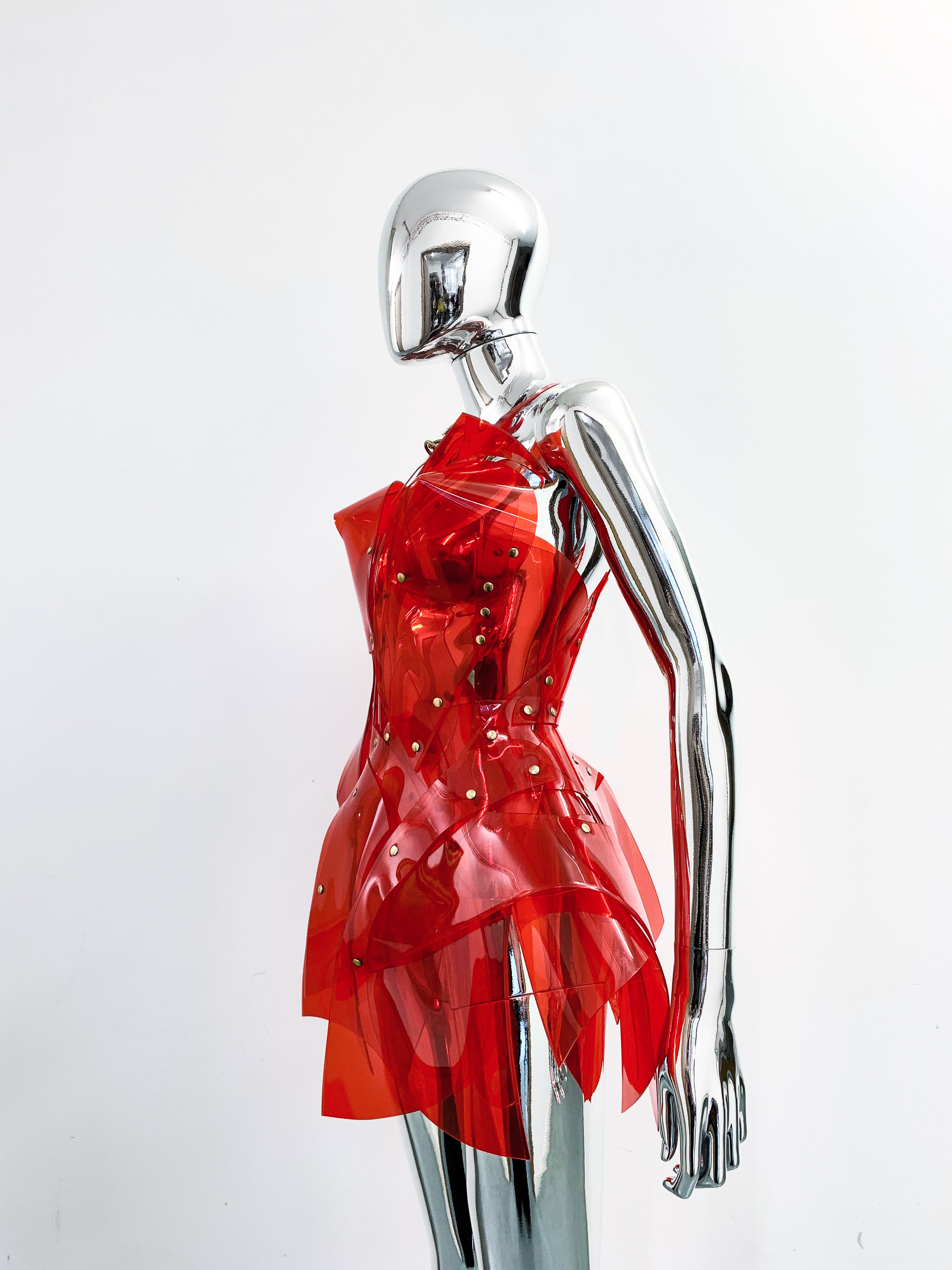 'Onna Bugeisha' collection Jivomir Domoustchiev Asymmetric V Dress lovingly made to order in our east London atelier in vegan vinyl and available in a variety of stunning colours and studding details. An artist expression pure asymmetrical balance contact@jivomirdomoustchiev.com As with all Jivomir Domoustchiev pieces are hand crafted to order please allow up to 4 weeks for shipping.  Shown in clear Valentines Red.