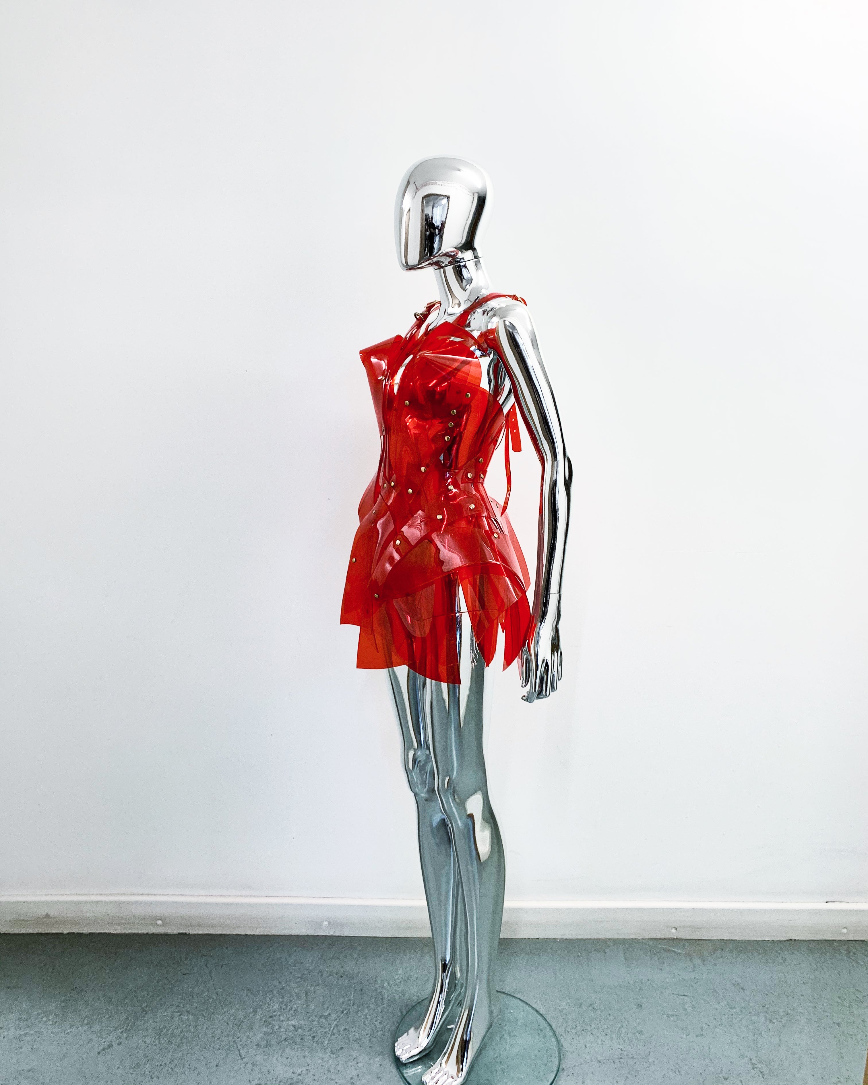 'Onna Bugeisha' collection Jivomir Domoustchiev Asymmetric V Dress lovingly made to order in our east London atelier in vegan vinyl and available in a variety of stunning colours and studding details. An artist expression pure asymmetrical balance contact@jivomirdomoustchiev.com As with all Jivomir Domoustchiev pieces are hand crafted to order please allow up to 4 weeks for shipping.  Shown in clear Valentines Red.