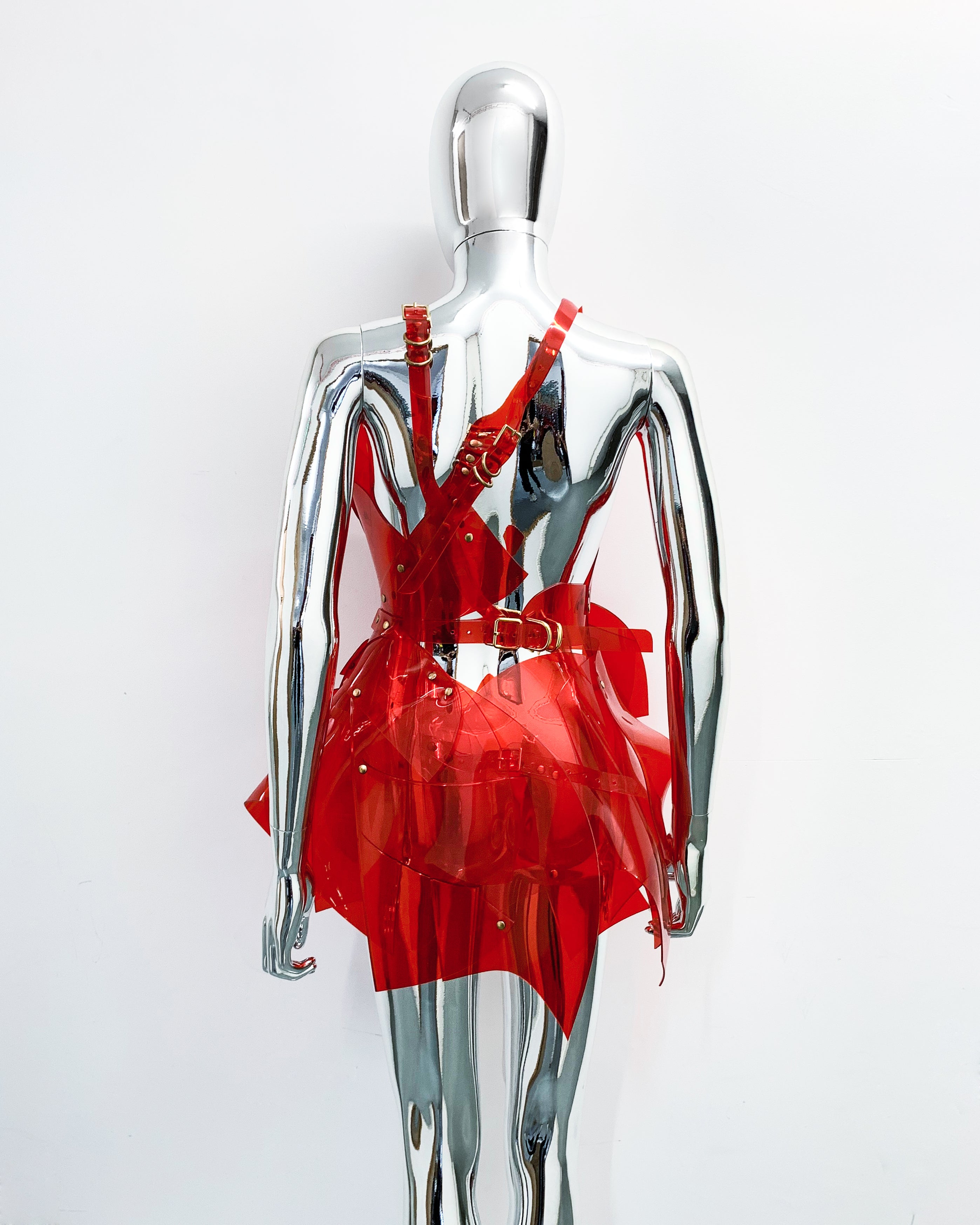 'Onna Bugeisha' collection Jivomir Domoustchiev Asymmetric V Dress lovingly made to order in our east London atelier in vegan vinyl and available in a variety of stunning colours and studding details. An artist expression pure asymmetrical balance contact@jivomirdomoustchiev.com As with all Jivomir Domoustchiev pieces are hand crafted to order please allow up to 4 weeks for shipping.  Shown in clear Valentines Red.