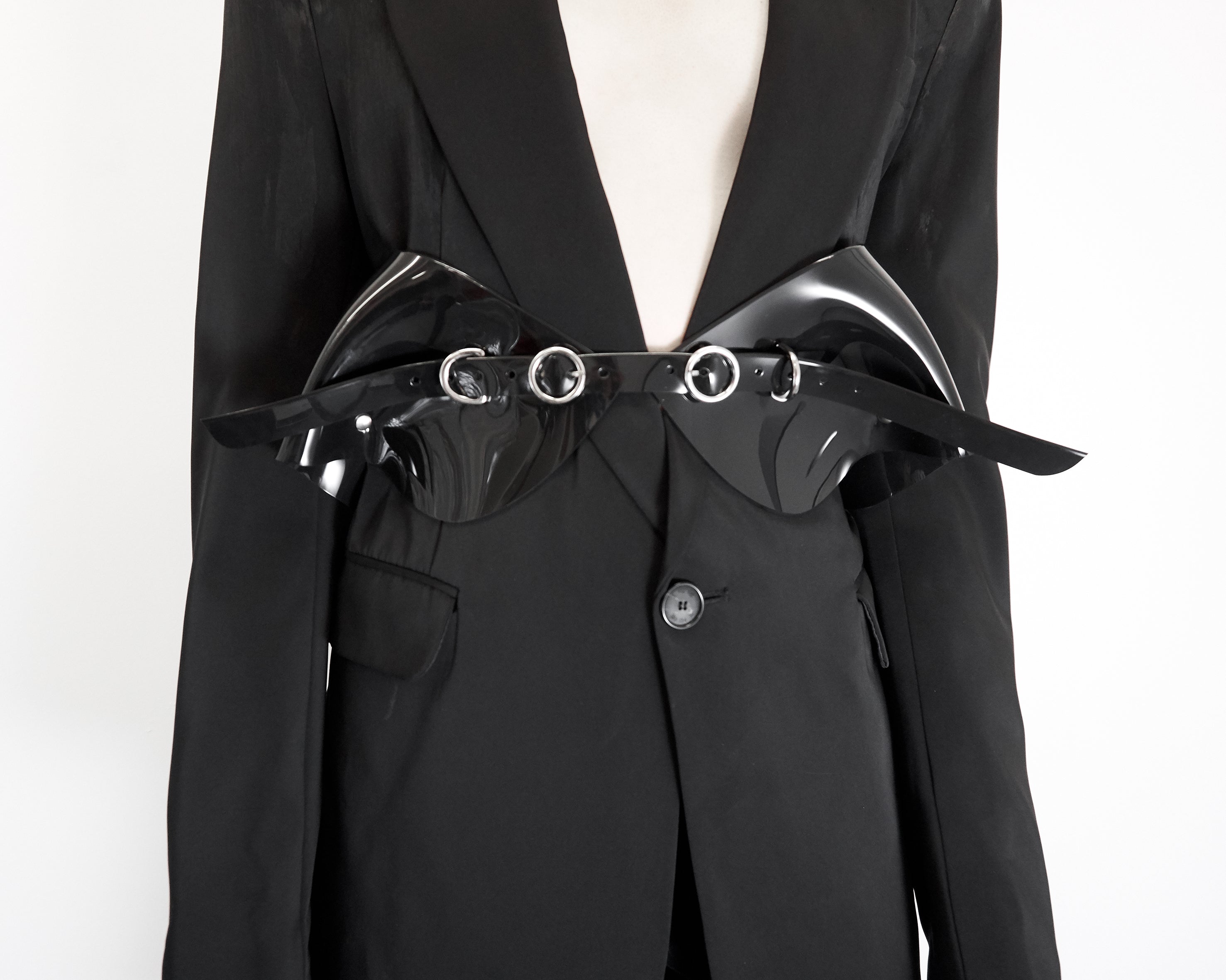 The must have Jivomir Domoustchiev vinyl sculpted belt. Finished with chrome look buckles and studding adjustable for comfort fit. Looks stunning warn over everything.  Collectible and available in a variety of striking must have colours. From midnight black. transparent Red, clear, white and more