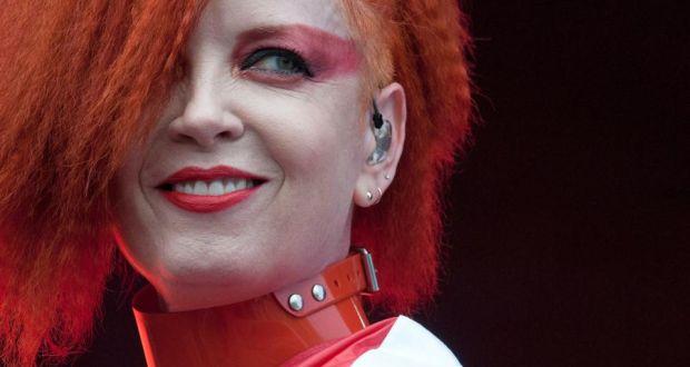 Jivomir Domoustchiev iconic vinyl chocker as seen in the Year and Years Sanctify video. available in a variety of colours. Simple yet striking adjustable for comfort. Finished with silver look studding & buckle. Complements any outfit.