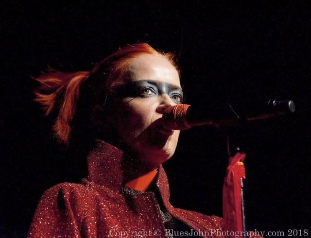 Jivomir Domoustchiev iconic vinyl chocker as seen in the Year and Years Sanctify video. available in a variety of colours. Simple yet striking adjustable for comfort. Finished with silver look studding & buckle. Complements any outfit.