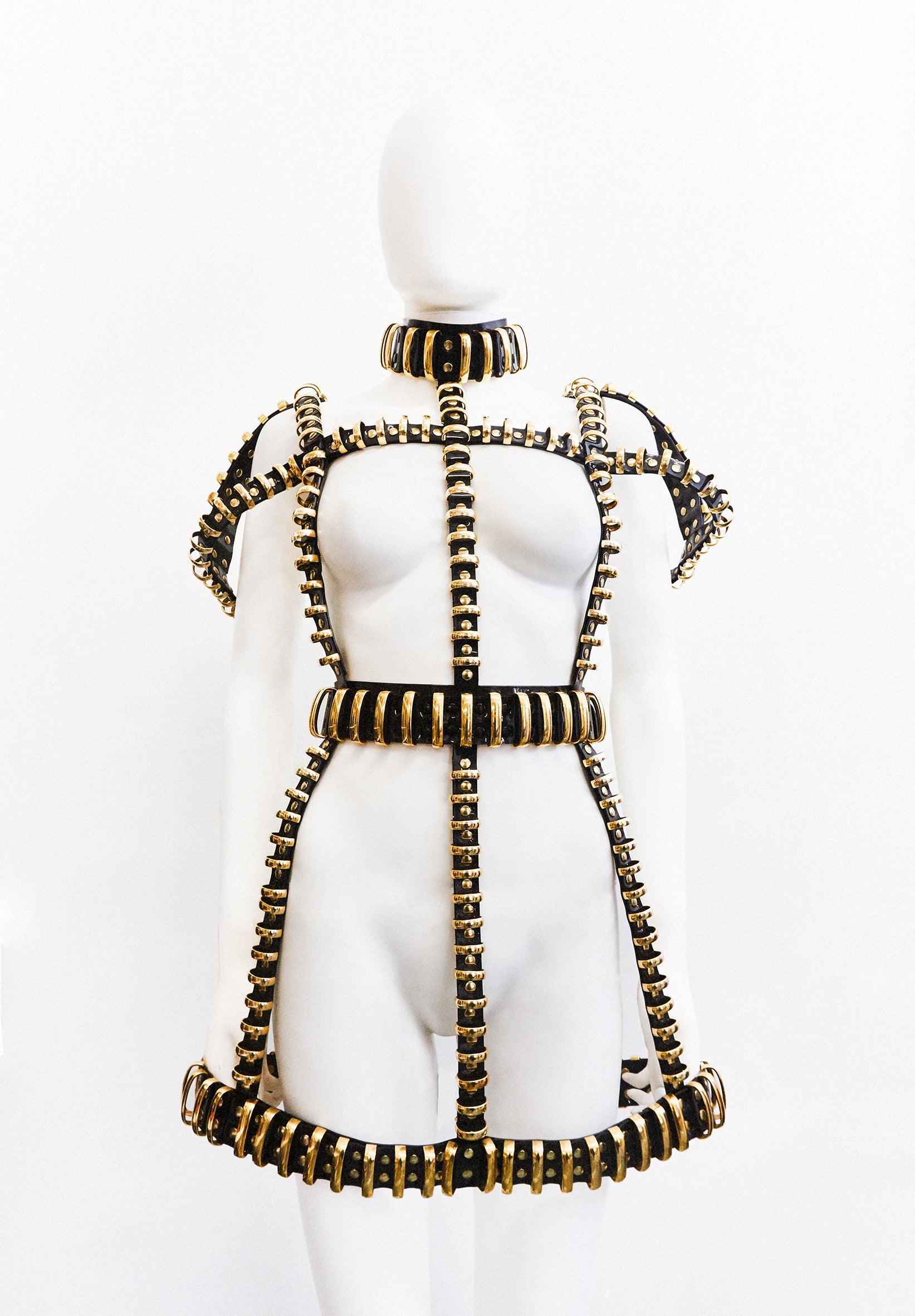 Jivomir Domoustchiev multi ring harness dress gold tone