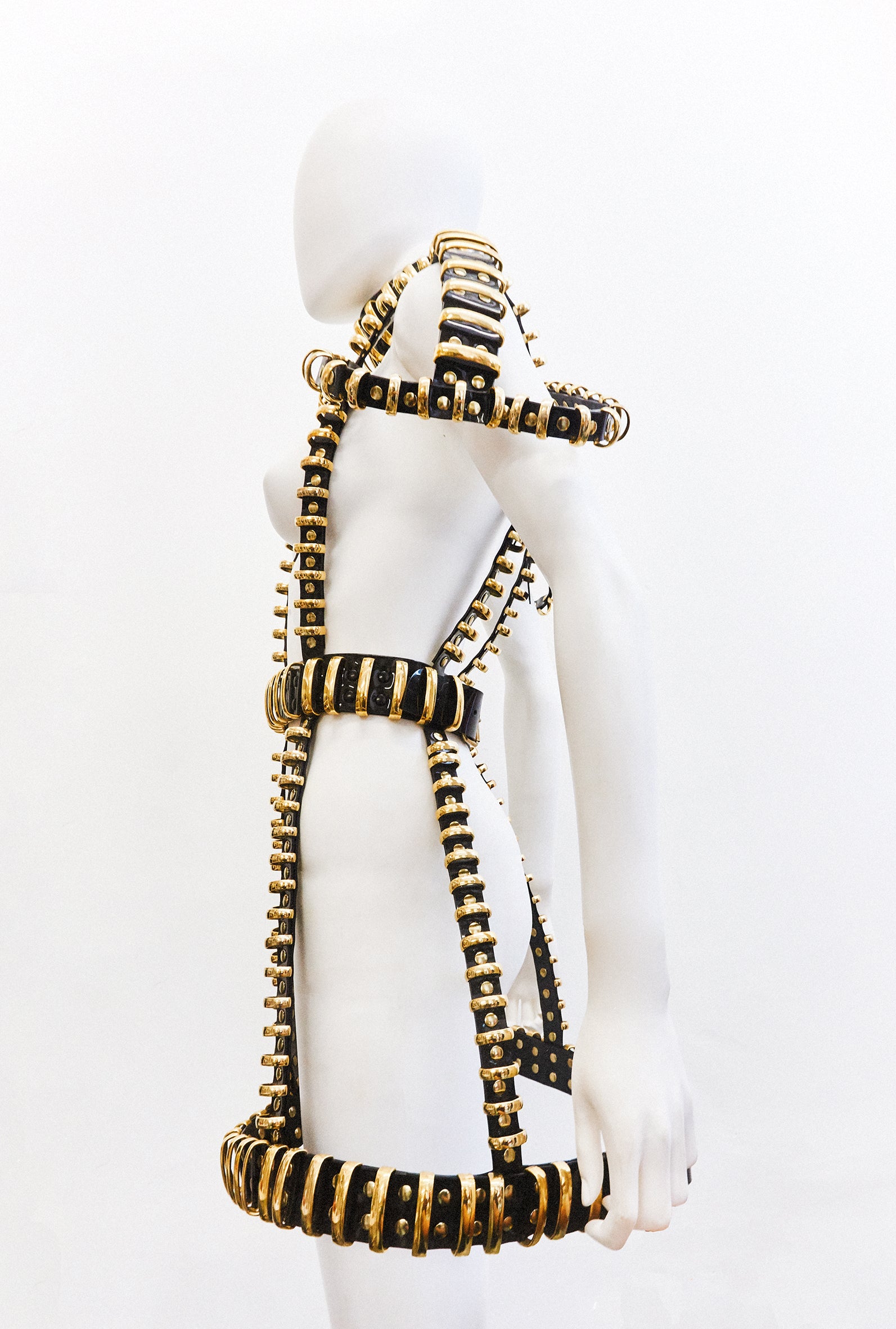Jivomir Domoustchiev multi ring harness dress gold tone