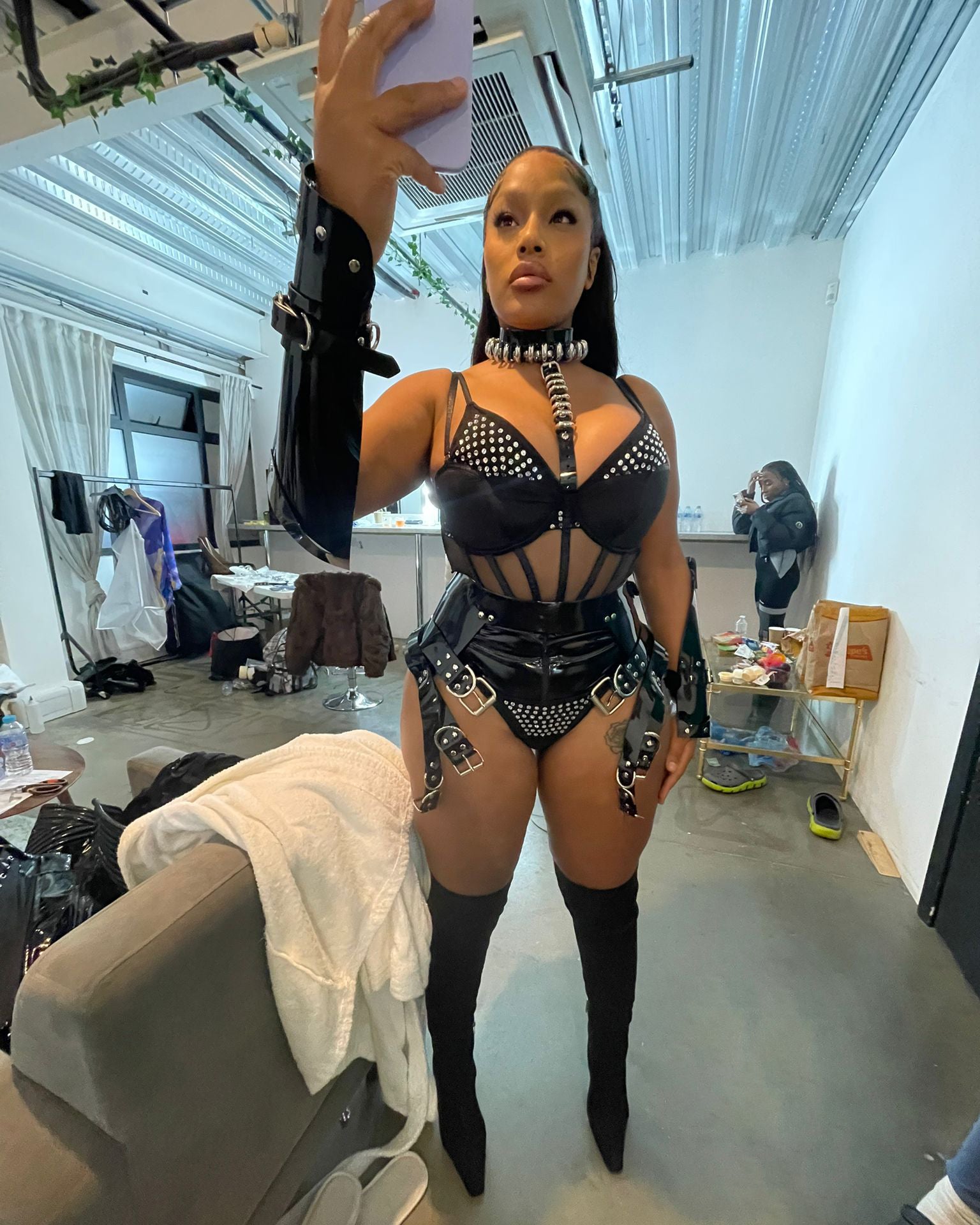 Steff London wearing custom Jivomir Domoustchiev vegan harness multi belt and cuffs