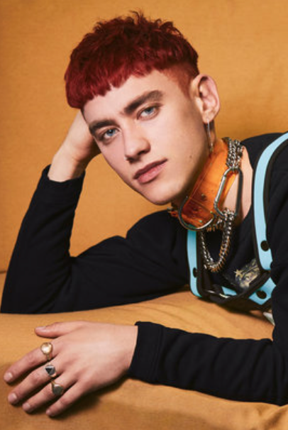 Olly Alexander from the band Years and Years wearing Jivomir Domoustchiev clear yellow vinyl collar for Paper Magazine