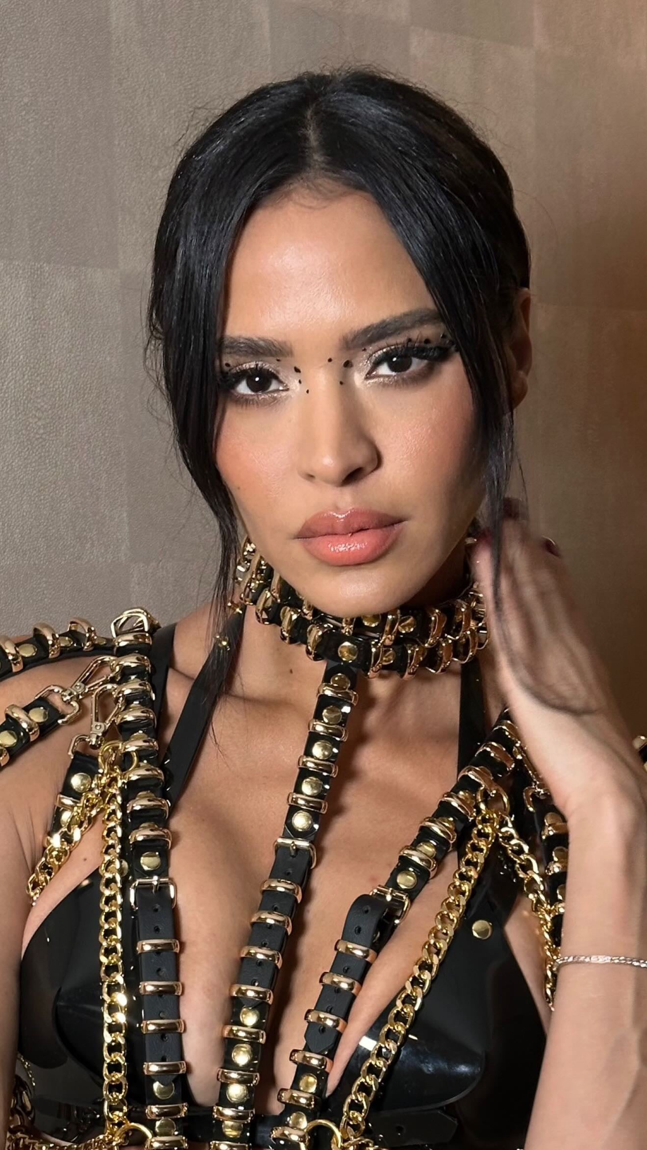 Leila Ben Khalifa wearing ATÉLIER JIVOMIR Robo Purity Set in transparent red vegan vinyl in Miami
