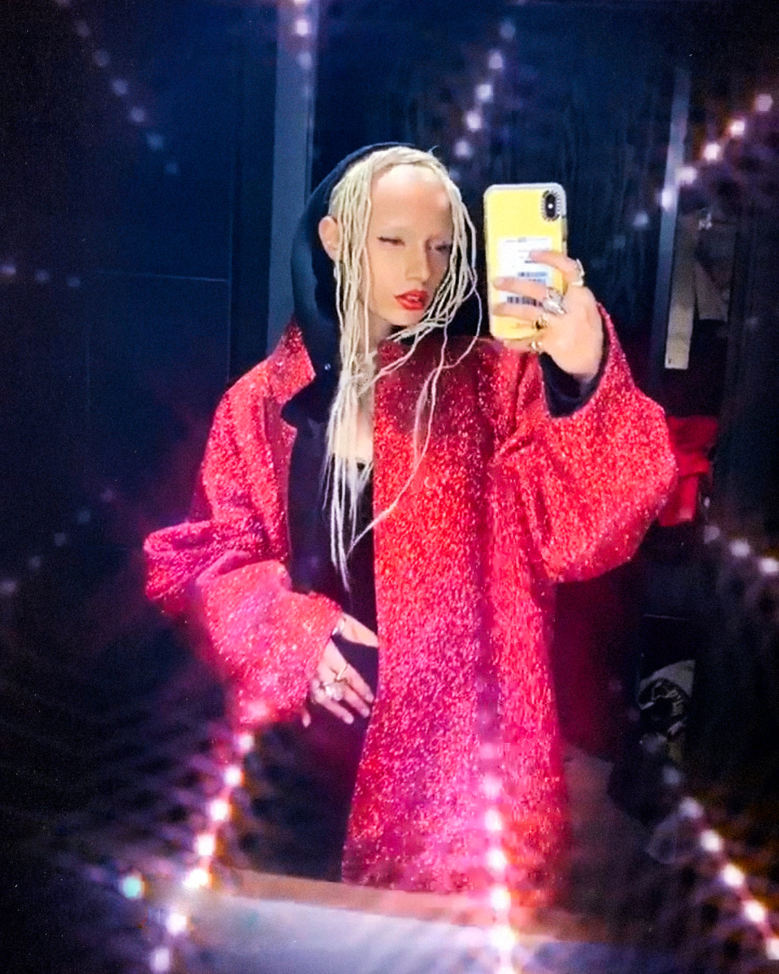 Uglyworldwide wearing Jivomir Domoustchiev red glitter coat PFW