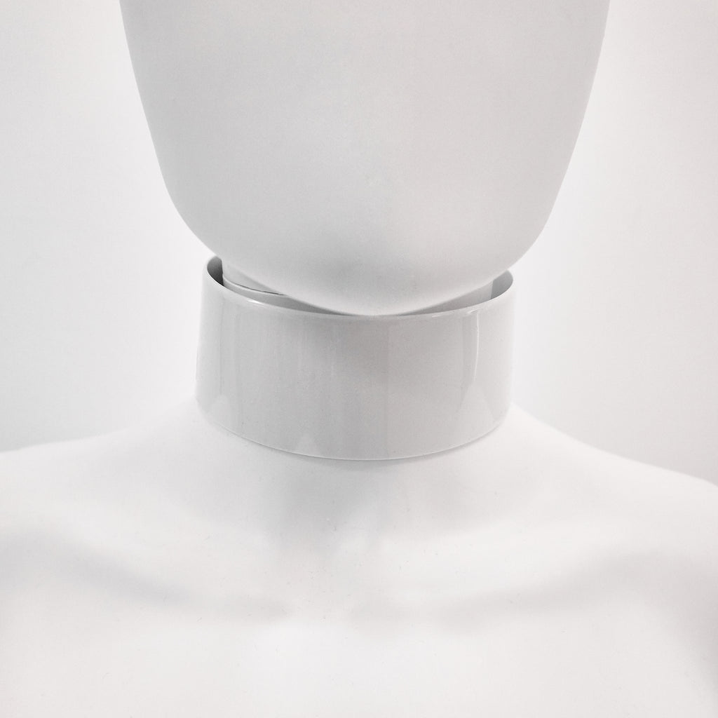 Jivomir Domoustchiev iconic vinyl chocker as seen in the Year and Years Sanctify video. available in a variety of colours. Simple yet striking adjustable for comfort. Finished with silver look studding & buckle. Complements any outfit.